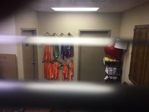 Colored sashes on the wall.