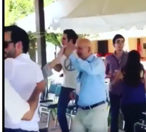 Emiliano [with sun glasses] [l] and Carlos [blue shirt and dancing ] at a party.