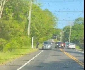 Ambrose, in red car, in a high speed chase, trying to run his teenage daughter off the road, because she wanted to leave his house.