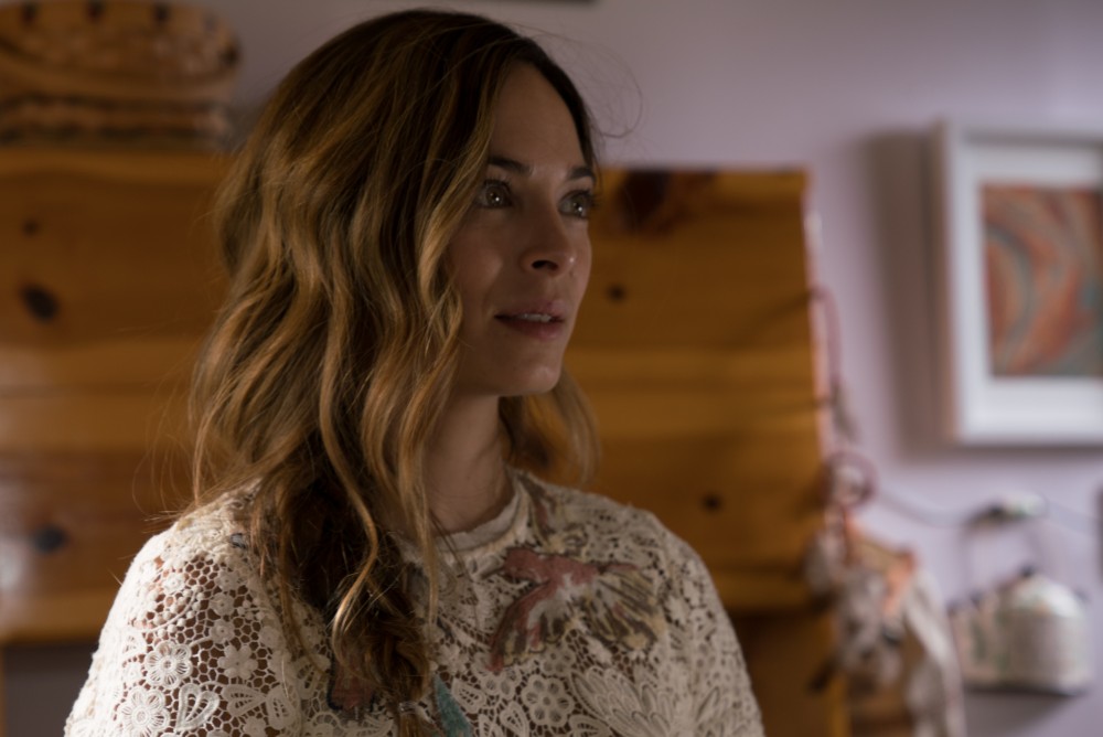 Kristin Kreuk plays fearless lawyer who exposes client who made girls sick; silent about her true life role in sex cult that brands women