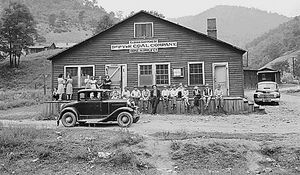 The company store kept miners in ever increasing debt to the company because of the high prices.