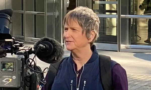 Susan Dones gives an interview outside the Brooklyn Courthouse.