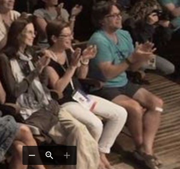 Last year's V Week had an estimated 400 attendees. This year there are en estimated 125. Mr. Raniere applauds the many homages to him last year. Seated next to him is Prefect, Nancy Salzman and the late Pamela Cafritz