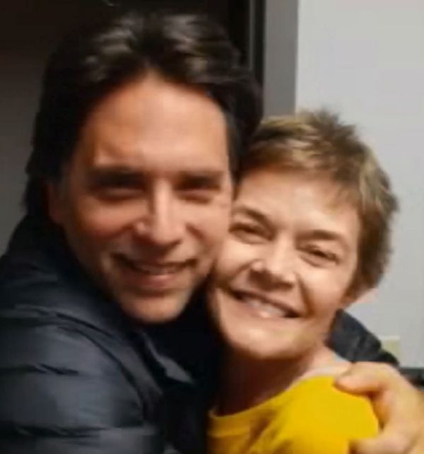 Keith Raniere gives a  loving hug to his aging inner circle member Barbara Jeske.