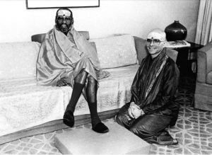 Like guru, like disciple: Russell Kruckman (kneeling) and his guru, the famous Swami Muktananda, who had a sex scandal of his own. In fact, for sheer numbers of female disciples he had [tantric] sex with, many in their teens, Muktananda seems to have far surpassed Kruckman, perhaps exponentially.