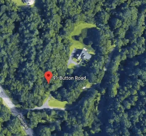 Clare's house was nestled in the woods
